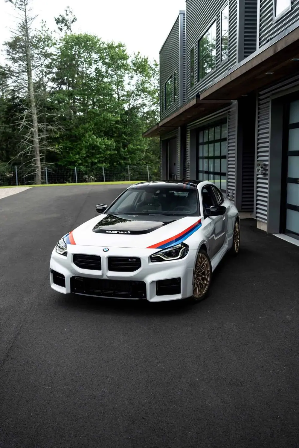 White 2026 BMW M2 with M stripes